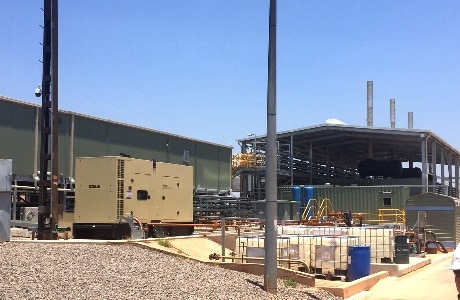 A photograph of the Tennant Creek power station including power house and Kohler diesel genset