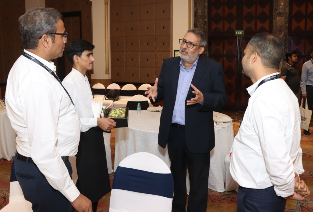 Attendees of the Gas to Energy Power Solutions Workshop in India discuss the presentation with Managing Director for Clarke Energy India & Bangladesh, Punit Garg